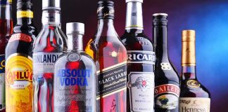 Assorted liquor bottles arranged in a row