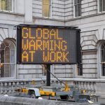 Portable LED sign in a historic courtyard