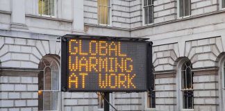 Portable LED sign in a historic courtyard