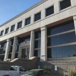 Property Seizures Floated — Maine Meltdown Modern office building with columns and reflective windows