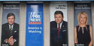 Tucker Carlson and Bret Baier on large Fox News promotional posters