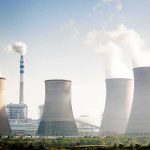Carbon Limits Vanish – Bills At Risk? Cooling towers emitting steam at an industrial power plant