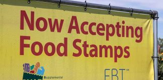 Yellow banner announcing acceptance of food stamps and EBT