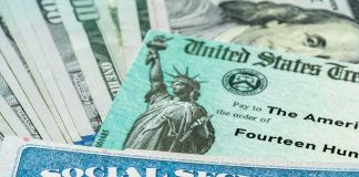 Social Security card and U.S. Treasury check on cash