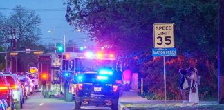 News Chopper Plummets Emergency vehicles with flashing lights on a city street at night