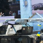 1,000 Drones Crash Russia’s Big Day Military drone mounted on armored vehicle