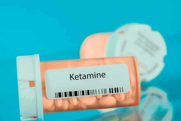 shutterstock_2140298313 Prescription pill bottle labeled ketamine on a blue background