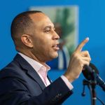 WOW – Eight Democrats Condemn Democratic Socialism Man speaking at a microphone with raised finger