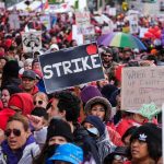 Citizenship Undermined? LA’s Bold Voting Gambit Chuck Howley and Christian Jones in a large protest crowd holding strike signs