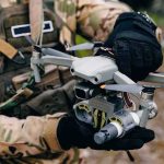 Cuba’s Drone Arsenal Sparks U.S. Fears Soldier holding a quadcopter drone with attached device