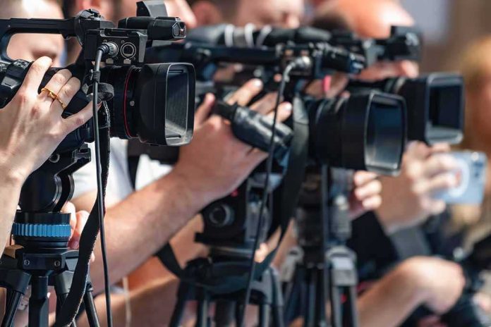 shutterstock_2692761619 television cameras on tripods at a media event