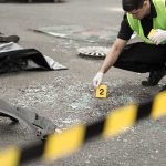 Counter-Terror Raid Halts “Big Damage” Plot Forensic investigator marking evidence at crash scene