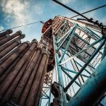 Cuba’s SHOCKING Admission: No Fuel Left! Oil drilling rig structure with stacked pipes viewed from below
