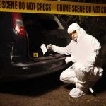 Chilling Find At Festival — Mother Missing forensic investigator at car trunk behind crime scene tape