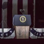 Presidential podium with microphones and teleprompters