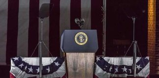Shock U-Turn: Iran Talks Roll On Presidential podium with microphones and teleprompters