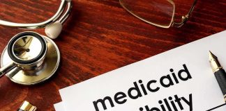 Gold, Properties Seized — Medicaid Scam Unraveled Medicaid eligibility form with stethoscope and pen on desk