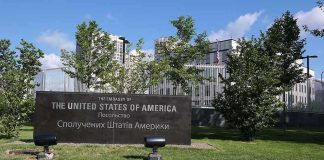 U.S. embassy sign in landscaped grounds