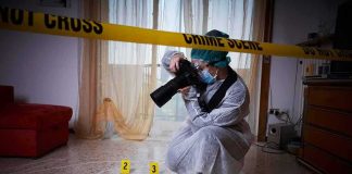 forensic photographer documenting indoor crime scene