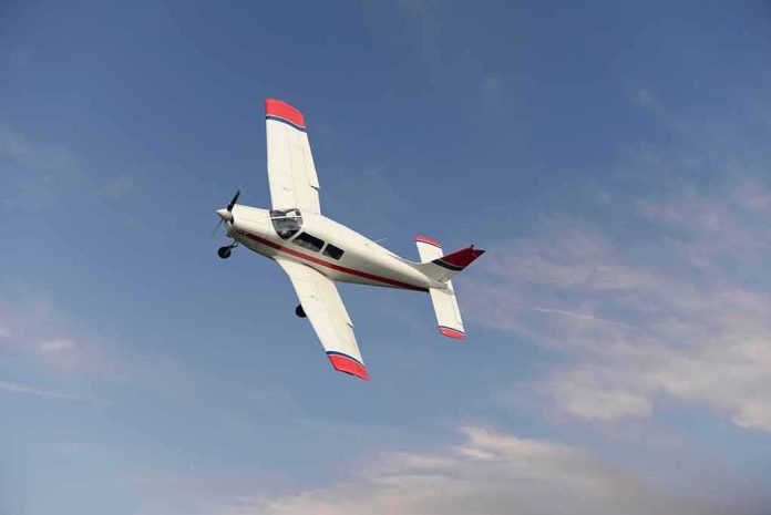 shutterstock_787587400 Single-engine airplane banking in a clear sky