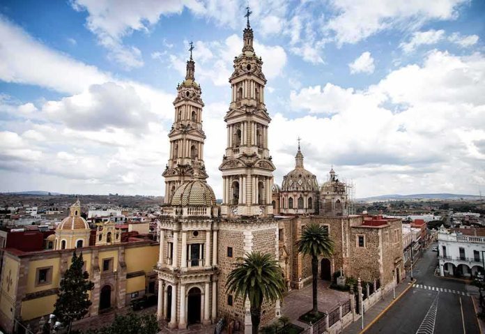 shutterstock_1311305450 historic cathedral with twin towers in a colonial cityscape