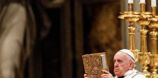 Vatican Jitters: Pope Heads Into Surgery Catholic priest holds ornate book during ceremony