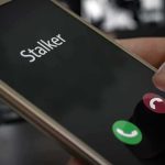 Cyberstalker Indicted After 40 Menacing Blasts Smartphone screen showing an incoming call with a thumb near the decline button