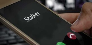 Smartphone screen showing an incoming call with a thumb near the decline button