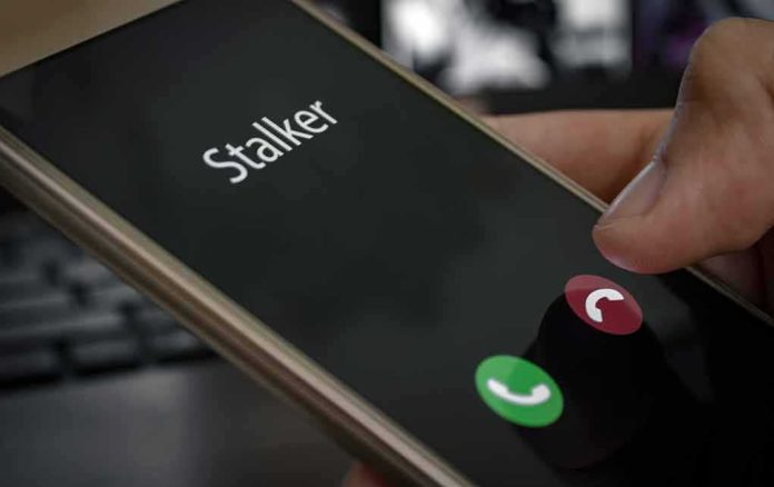Smartphone screen showing an incoming call with a thumb near the decline button