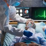 Psych Ward Exit – Then Death Approved? Patient on hospital bed with oxygen mask and medical staff in protective gear
