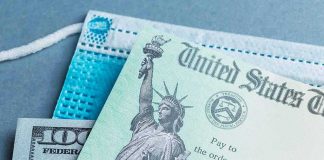 Obamacare Overcharge? $500 Checks Arrive U.S. Treasury check with face mask and hundred-dollar bill