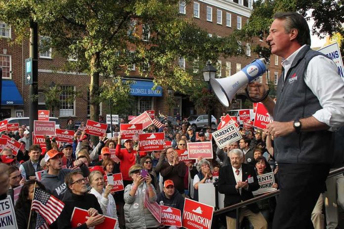 shutterstock_2066422511 Speaker with megaphone addresses campaign rally crowd