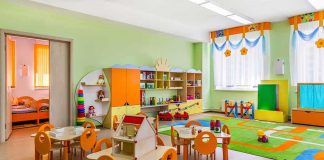 English Teacher Jailed For Assaulting 22 Children! Preschool classroom with colorful furniture and toys